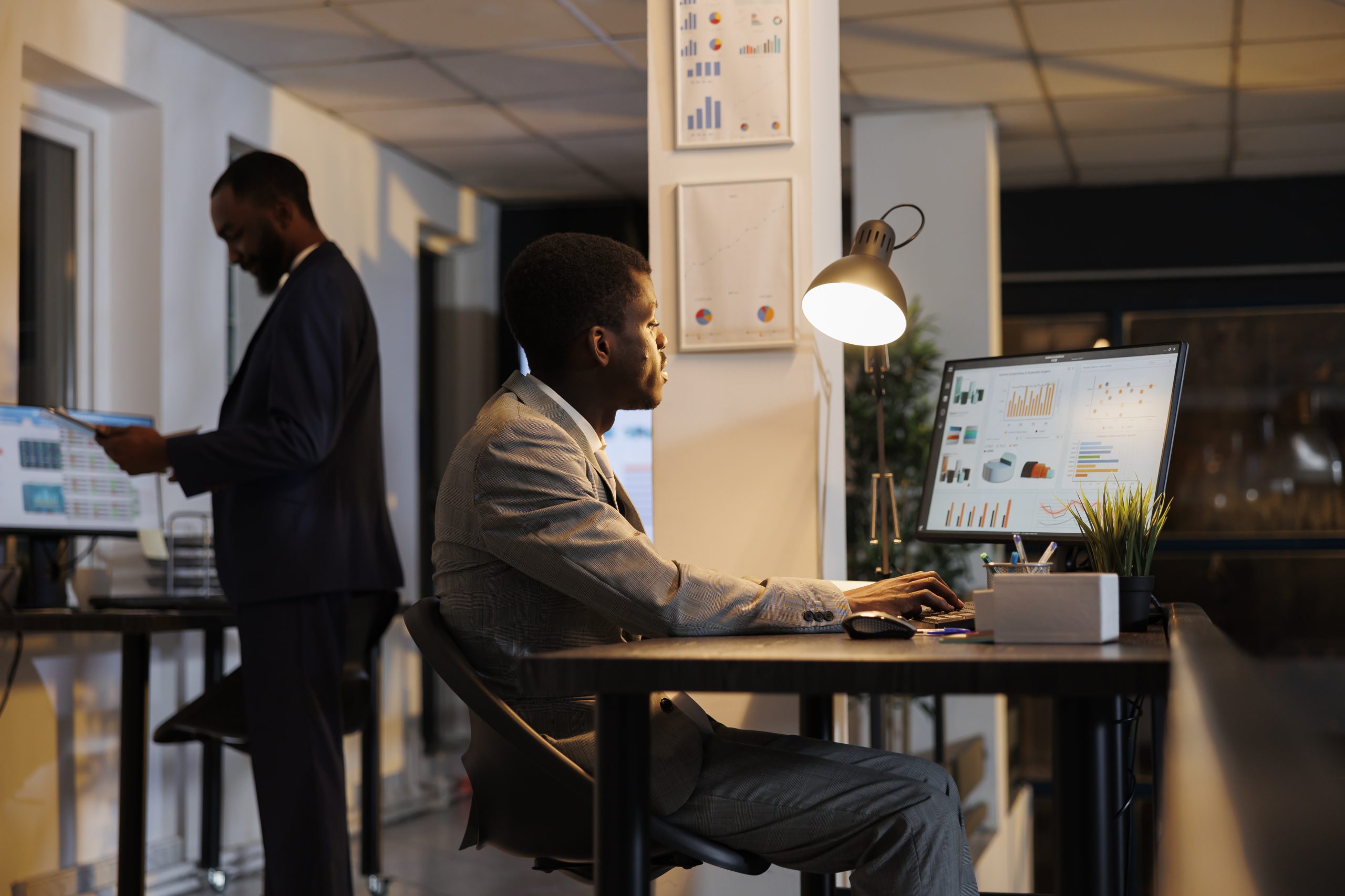 african american businessman looking at financial graphs