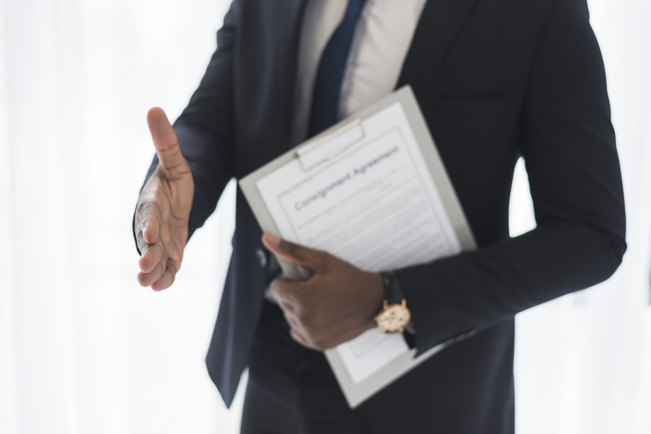 ethnic businessman giving hand shake